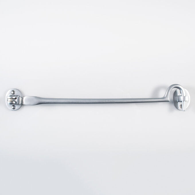 Long silver ratchet spanner on white background