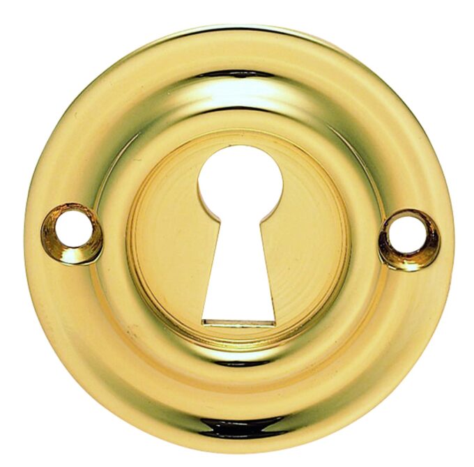 Brass keyhole on a polished door plate