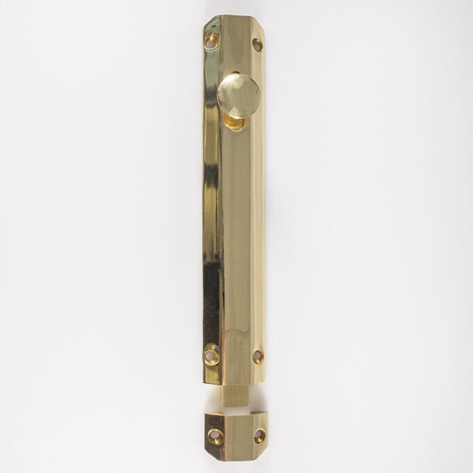 Brass door push plate on white background.