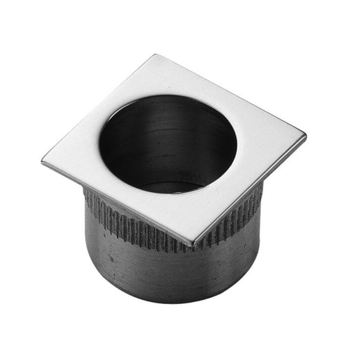 Square metal desk grommet on white background.