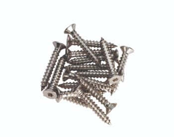 Pile of silver Phillips head screws isolated on white