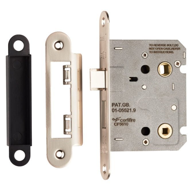 Disassembled brass sash lock with components on white background.