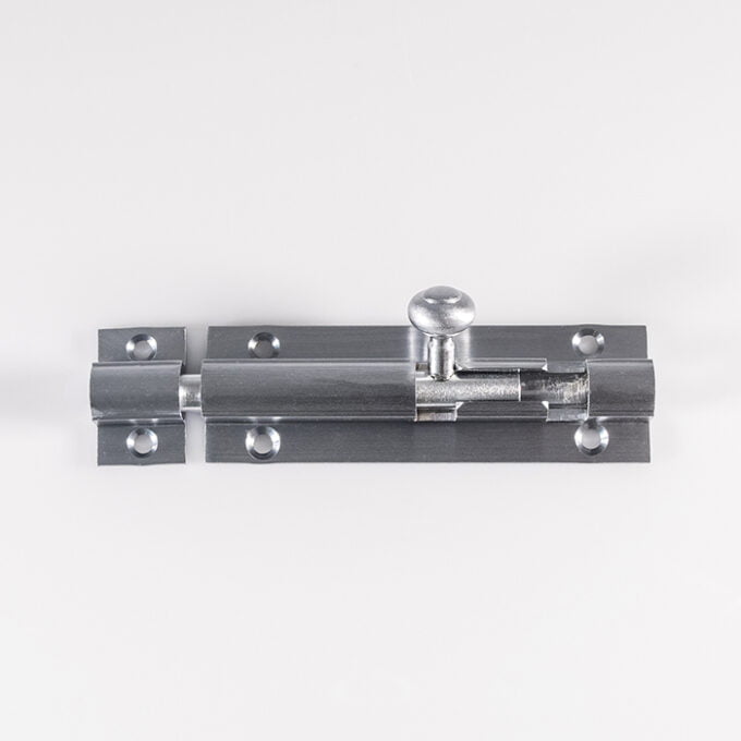 Silver slide bolt lock on white background.