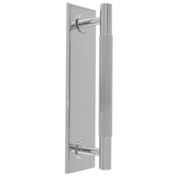 Modern chrome door handle on reflective plate.