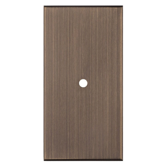 Brown wooden cabinet door with circular handle hole.