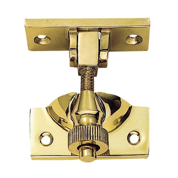 Brass cabinet hinge hardware close-up image.