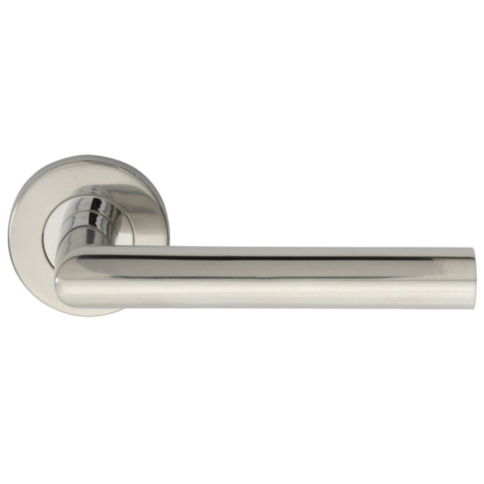 Modern chrome door handle on round rosette