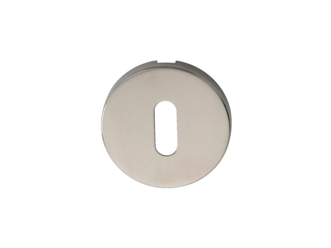 Round metal keyhole cover isolated on white background.