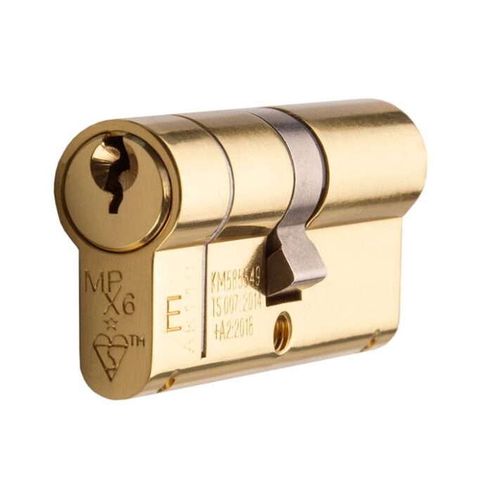 Gold cylinder lock isolated on white background.