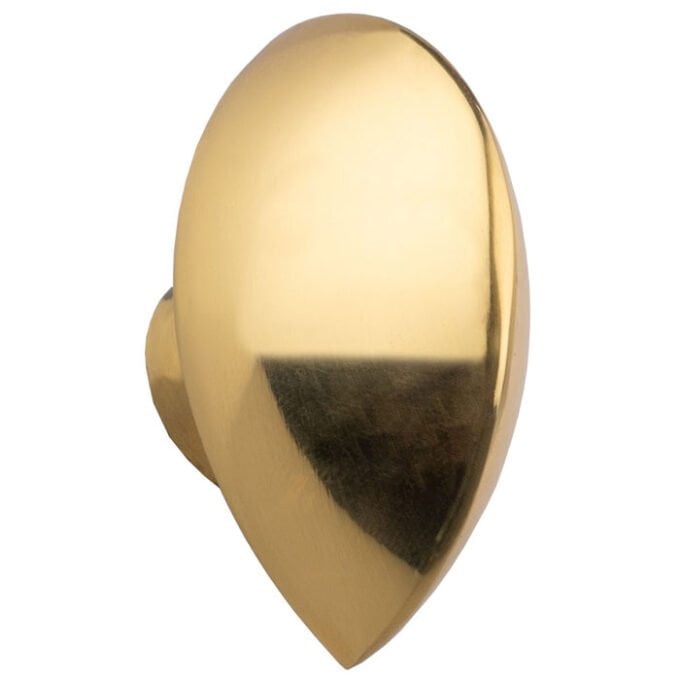 Polished gold door knob on white background.