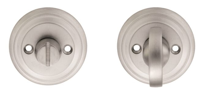 Stainless steel door knobs, one with handle engaged.