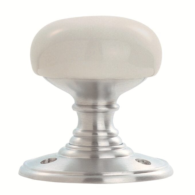 White porcelain cabinet knob with metallic base.