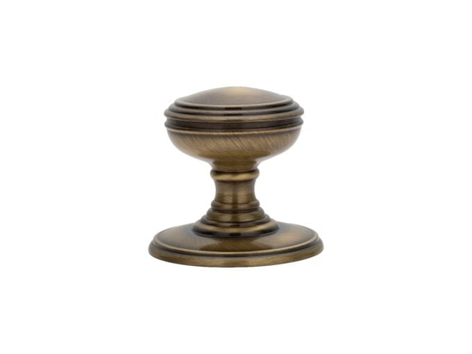 Antique bronze door knob on white background.