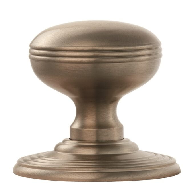 Antique bronze door knob on white background.